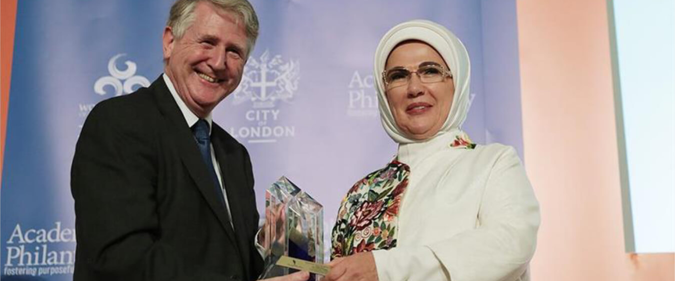 Hero image of someone receiving an award